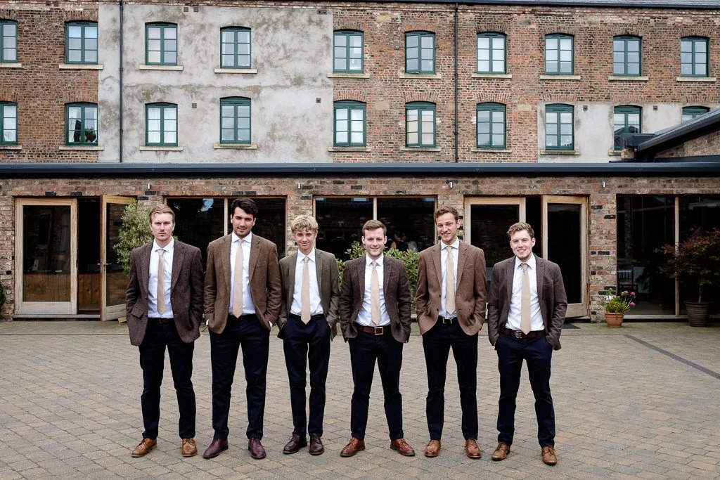 Group photograph of the groom, best man and ushers