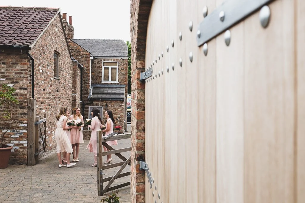 Bridesmaids waiting to go into the ceremony