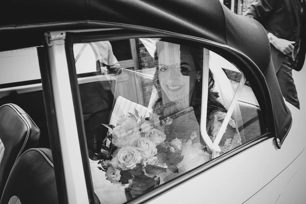 View of the bride arriving through the car window