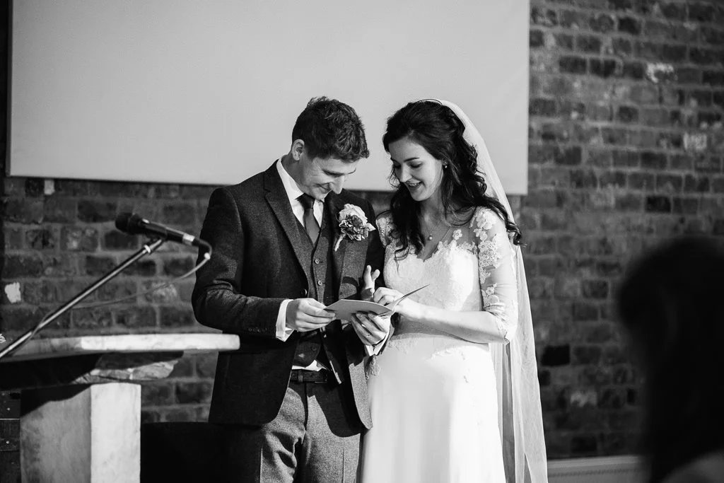 Bride and groom looking at their new rings
