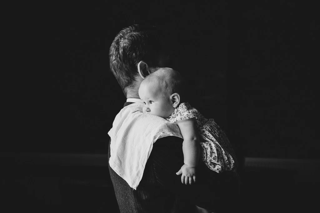 Dad carrying the baby