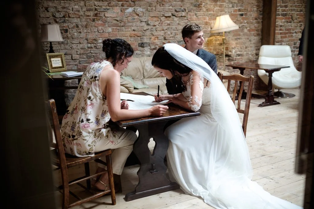 Becky signing the register