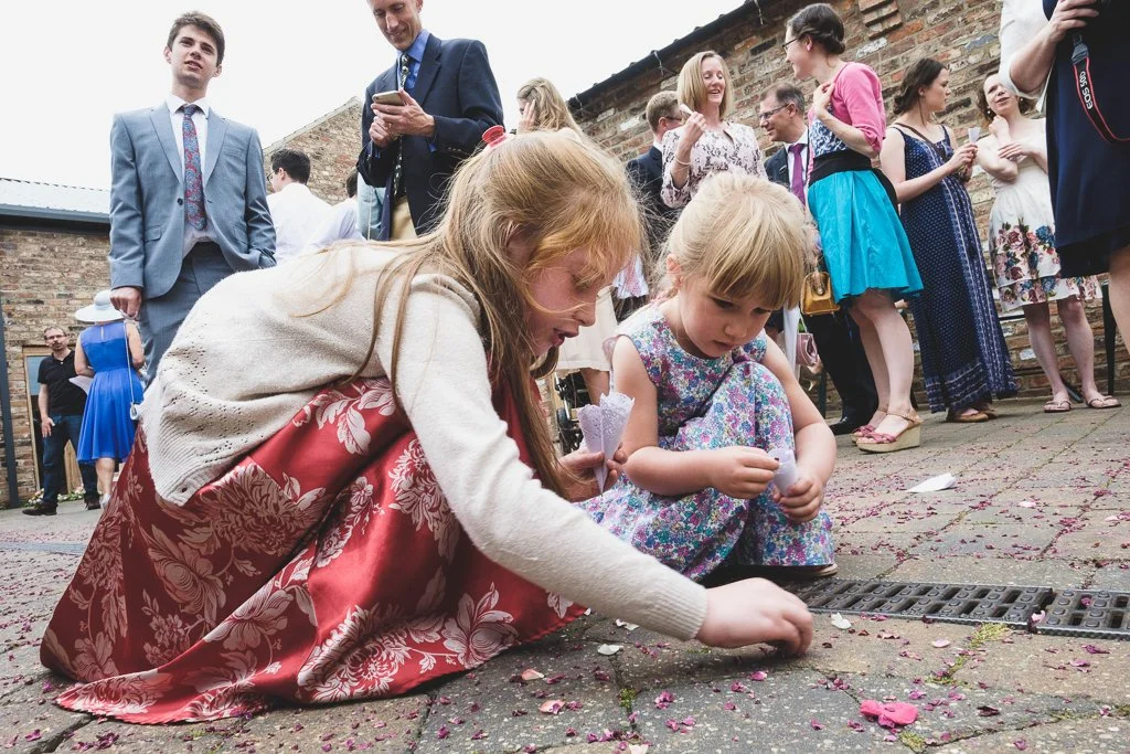 Children picking the confetti up