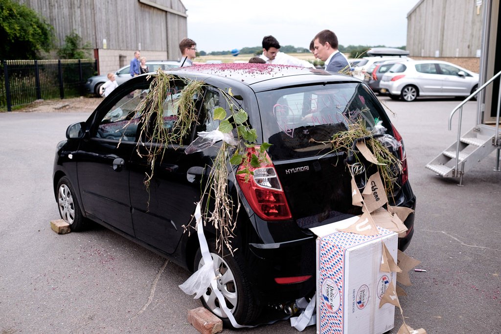 The poor car has been decorated by wedding guests