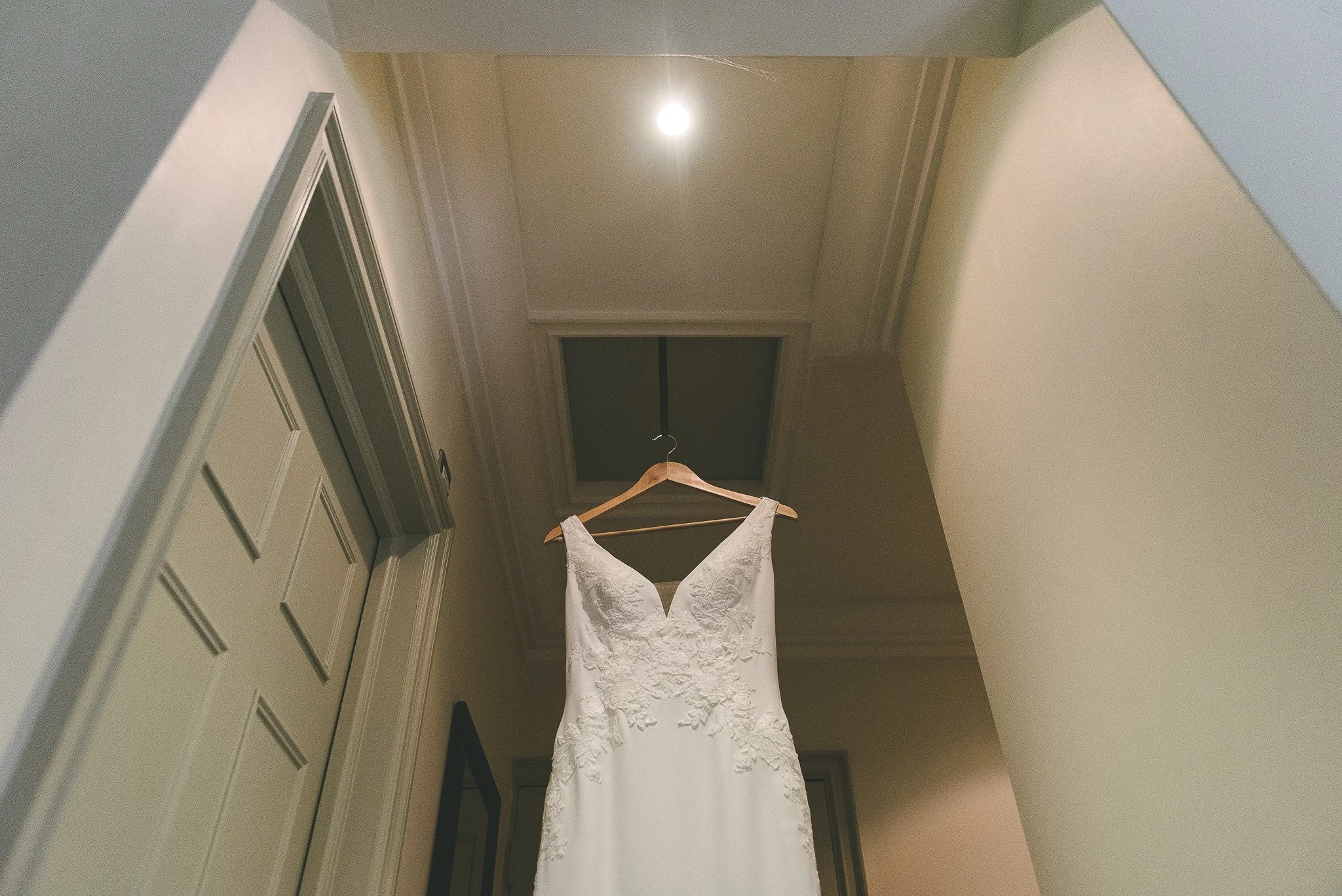 Using the loft hatch to hang the wedding dress up