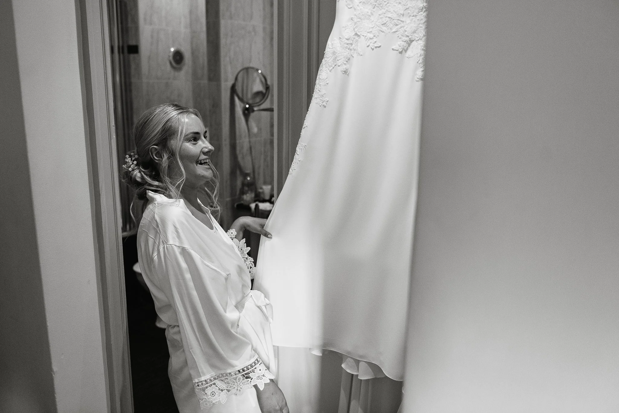 The bride looking at her dress