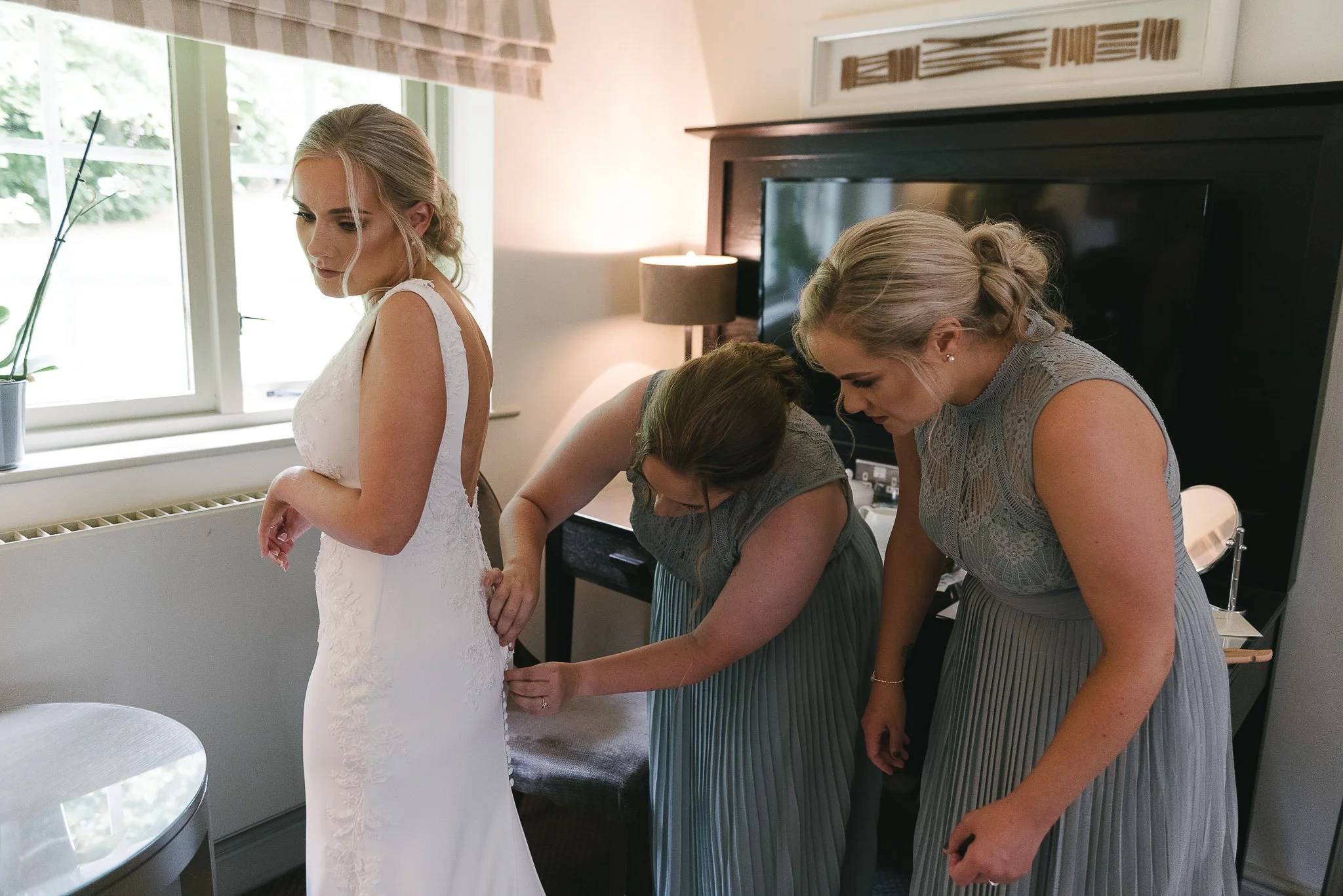 Fastening the wedding dress