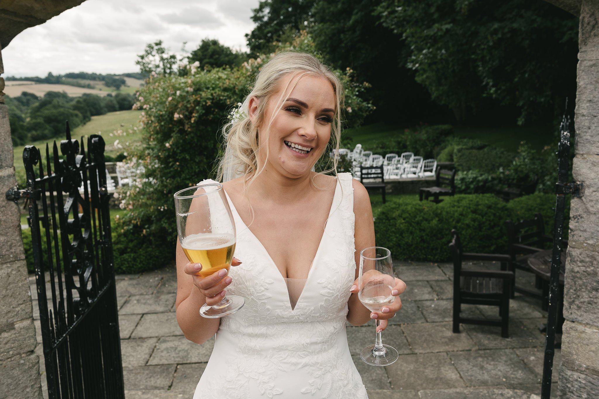 Bride with a glass in each hand