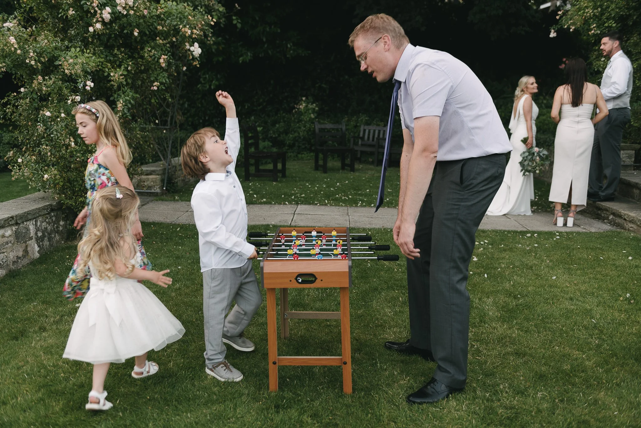 playing football at a wedding