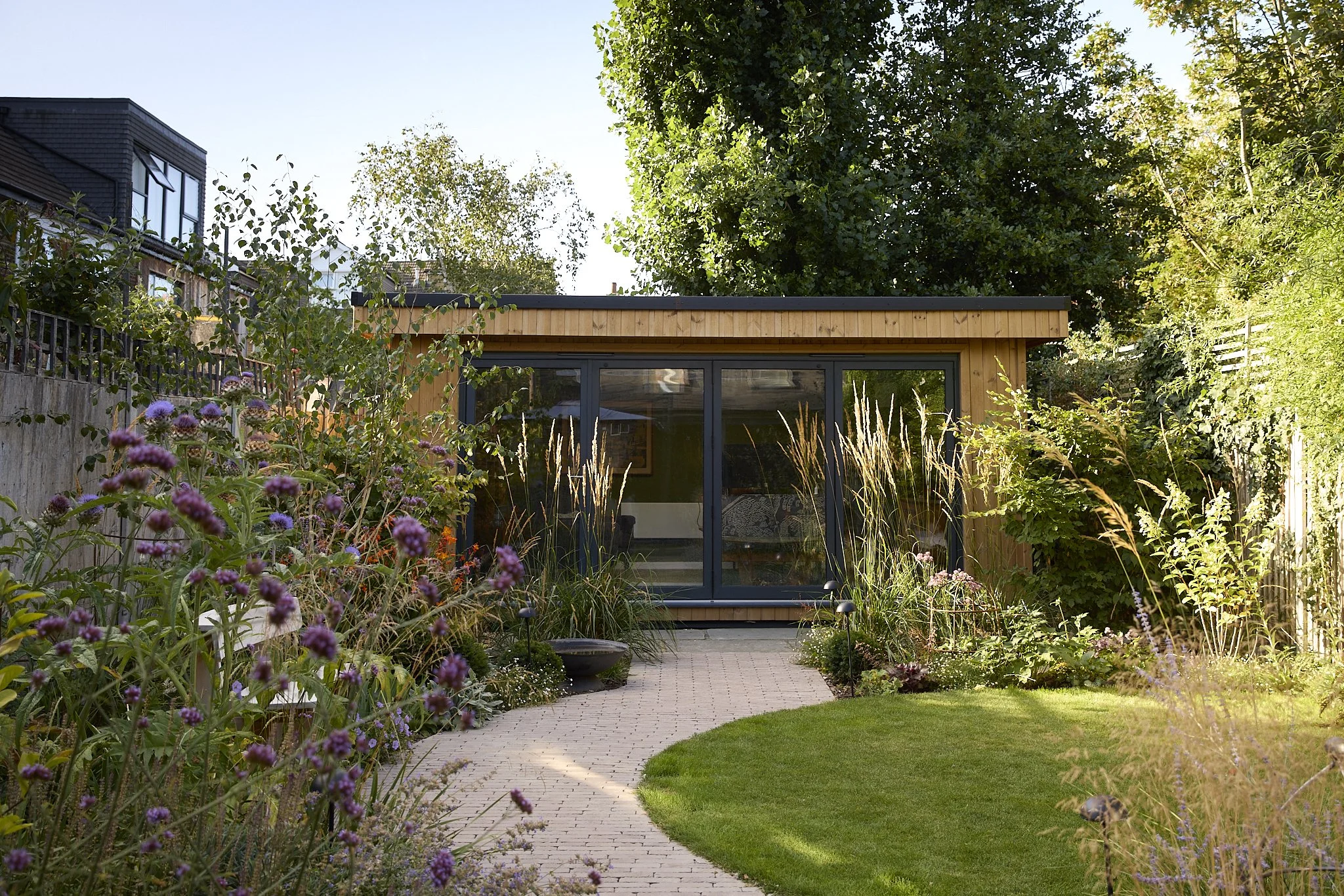 outdoor office, circular lawn, ornamental grasses