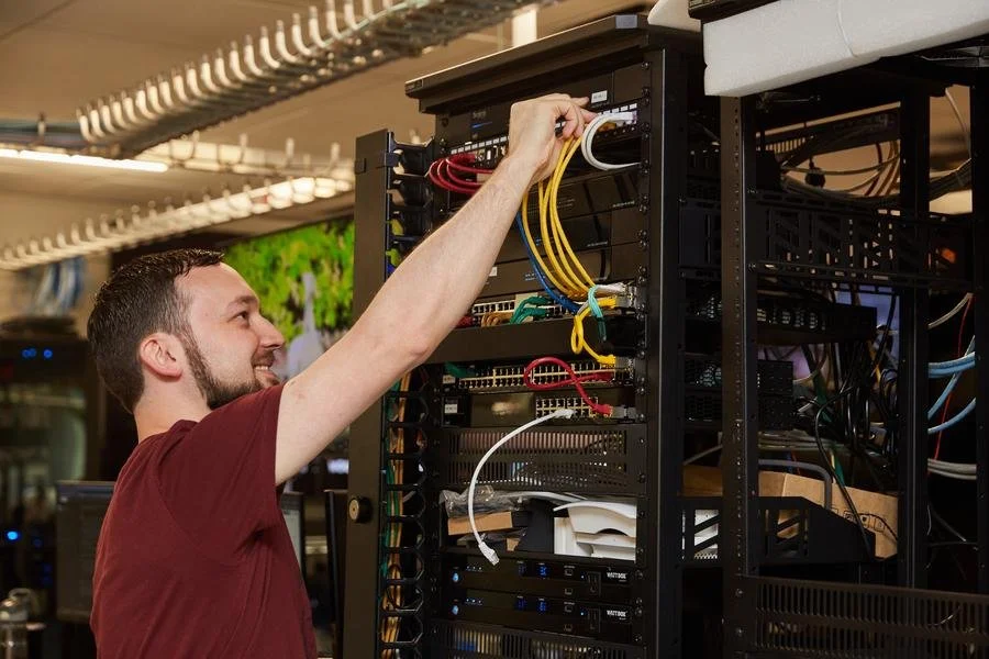 Smart home engineer maintaining a professionally installed home automation system.