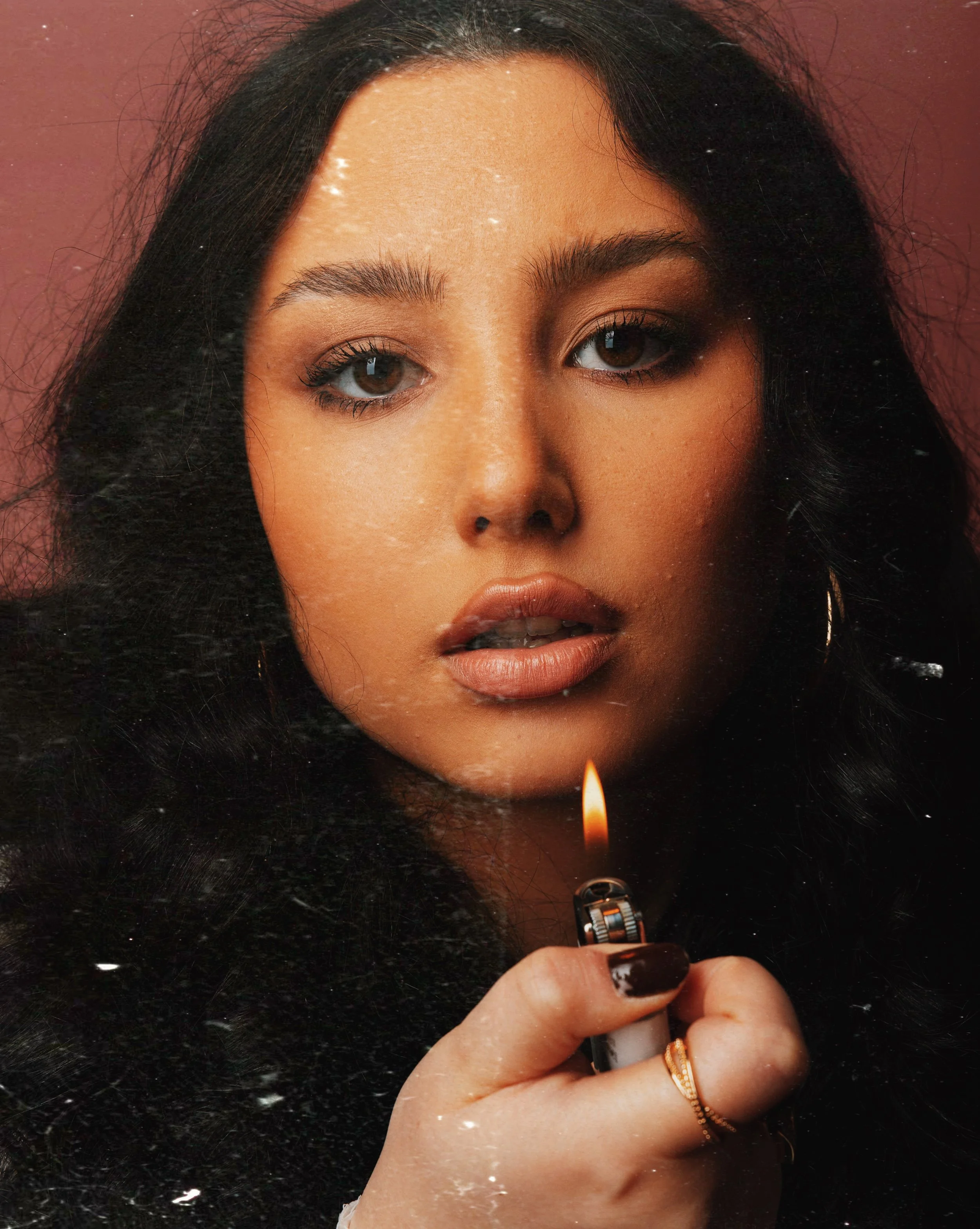 SHE WHO HOLDS THE FLAME