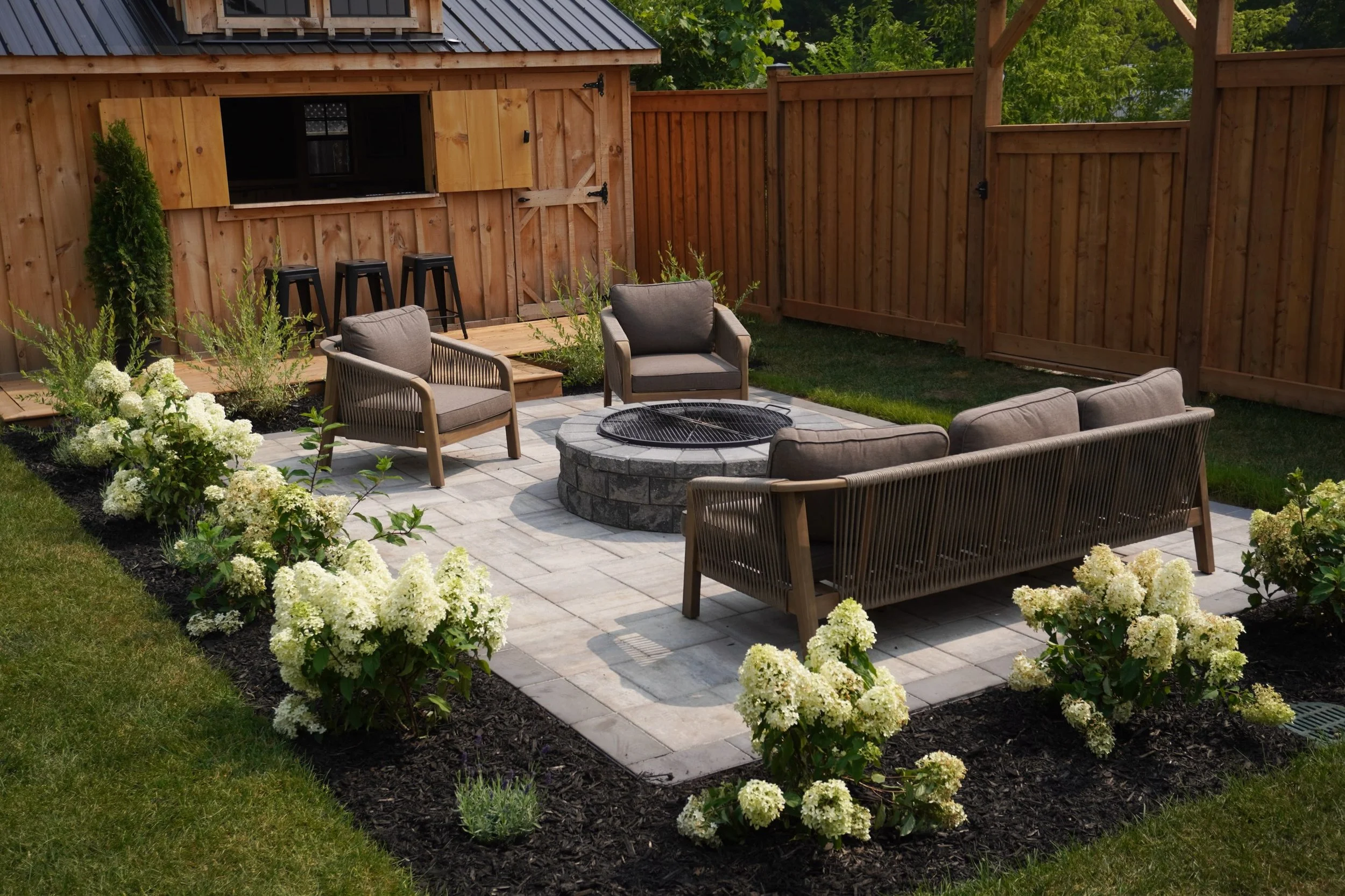 A beautiful project from a little while back.

We started by regrading the entire backyard and installing fresh sod to create a healthy lawn with proper drainage. Followed by some landscaping to bring it all together.

Simple, clean, and built to las