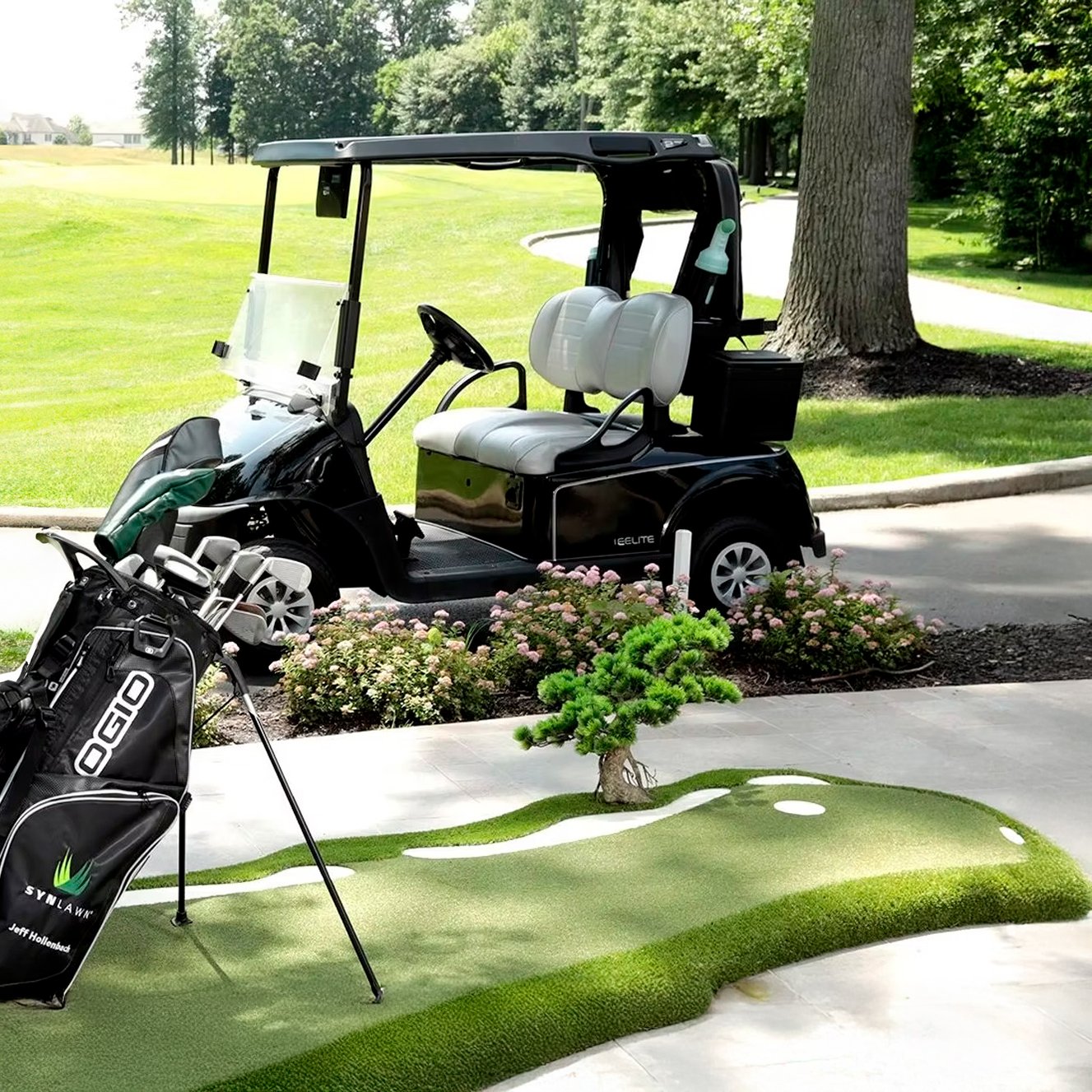 Golf cart parked on a pathway at a golf course with a putting green, golf bag, and a small tree in the foreground.