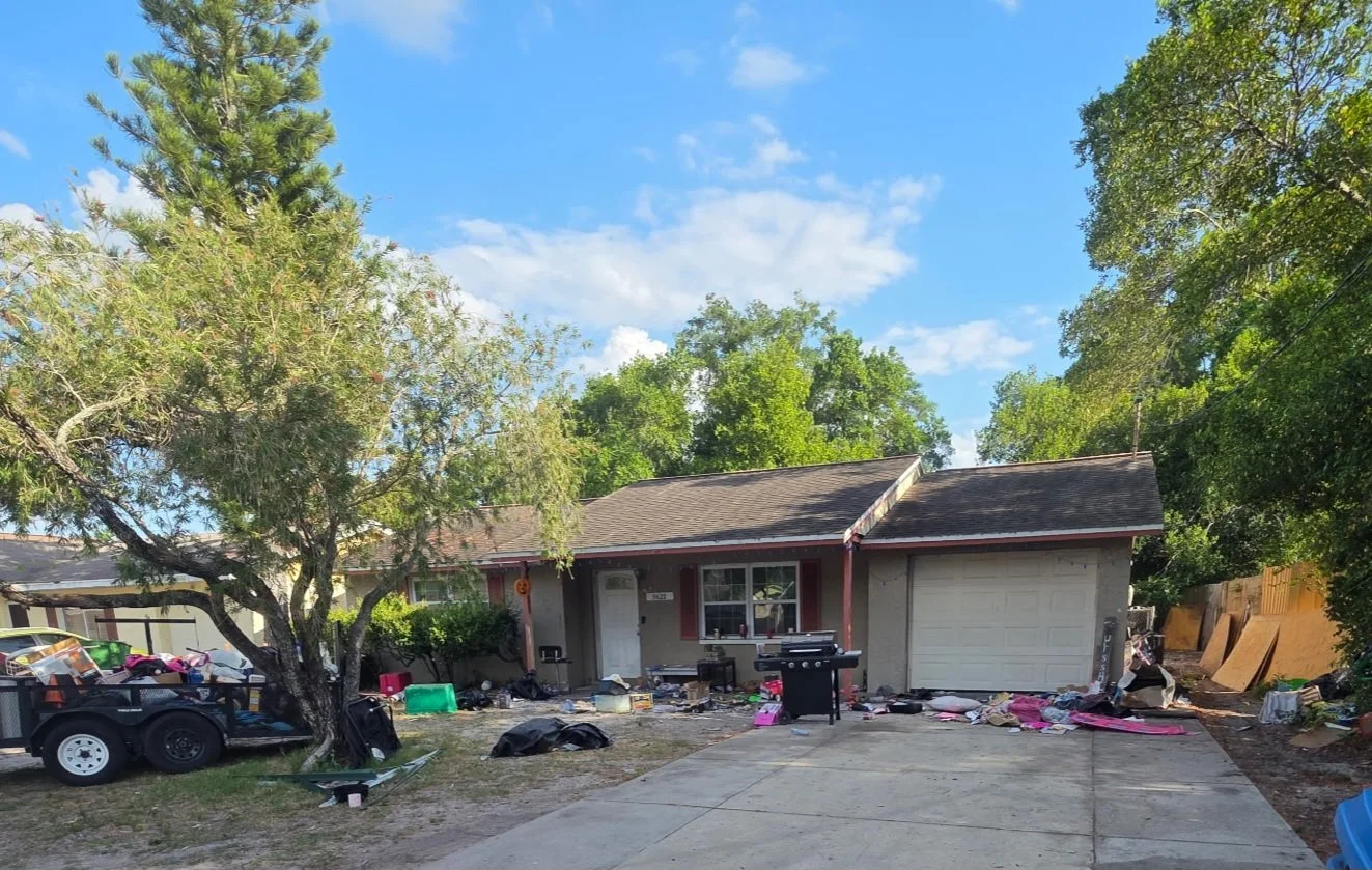 A cluttered house with unwanted items and debris that was cleared by Suncoast Hauling Services in Palm Harbor
