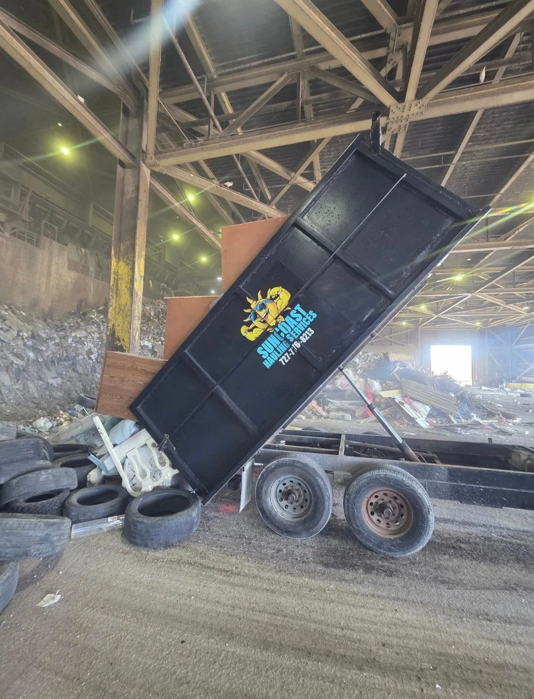 A dump trailer dumping junk and debris in pinellas county