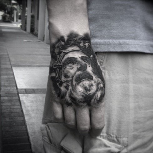 Black and gray tattoo of a statue on a person's hand, with the person's arm visible in the image. Tattoo, tattoo artist, tattoos, realistic tattoo, portrait tattoo, artistic tattoo, experienced tattoo artist, Oregon, tattoo artist near me, nature tat