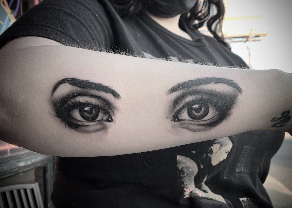 Tattoo of realistic eyes on a person's forearm. Tattoo, tattoo artist, tattoos, realistic tattoo, portrait tattoo, artistic tattoo, experienced tattoo artist, Oregon, tattoo artist near me, nature tattoo, tattoo shop, tattoo shop near me, black and g