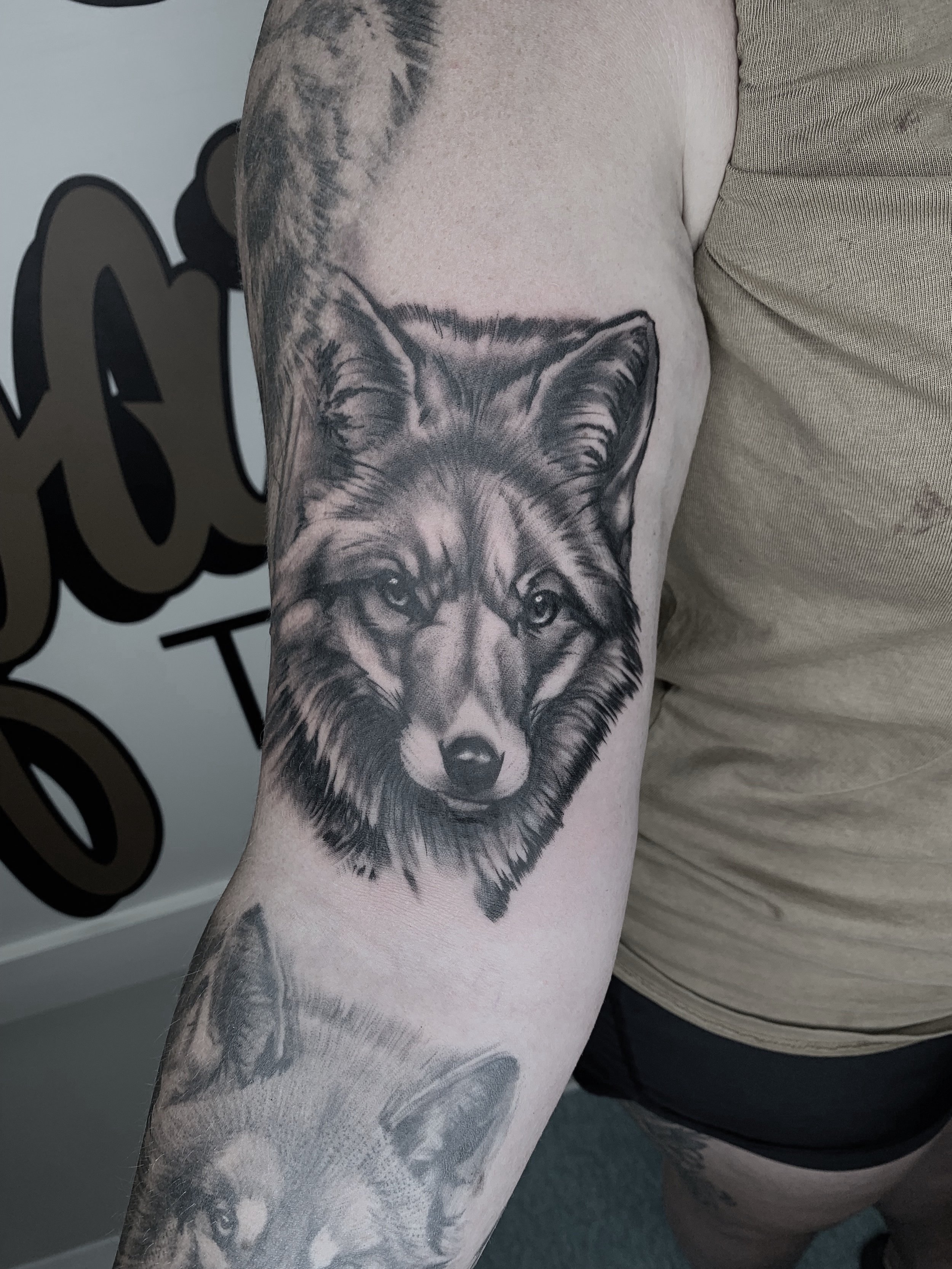 Black and grey tattoo of a fox’s face on a person's arm. Tattoo, tattoo artist, tattoos, realistic tattoo, portrait tattoo, artistic tattoo, experienced tattoo artist, Oregon, tattoo artist near me, nature tattoo, tattoo shop, tattoo shop near me, bl