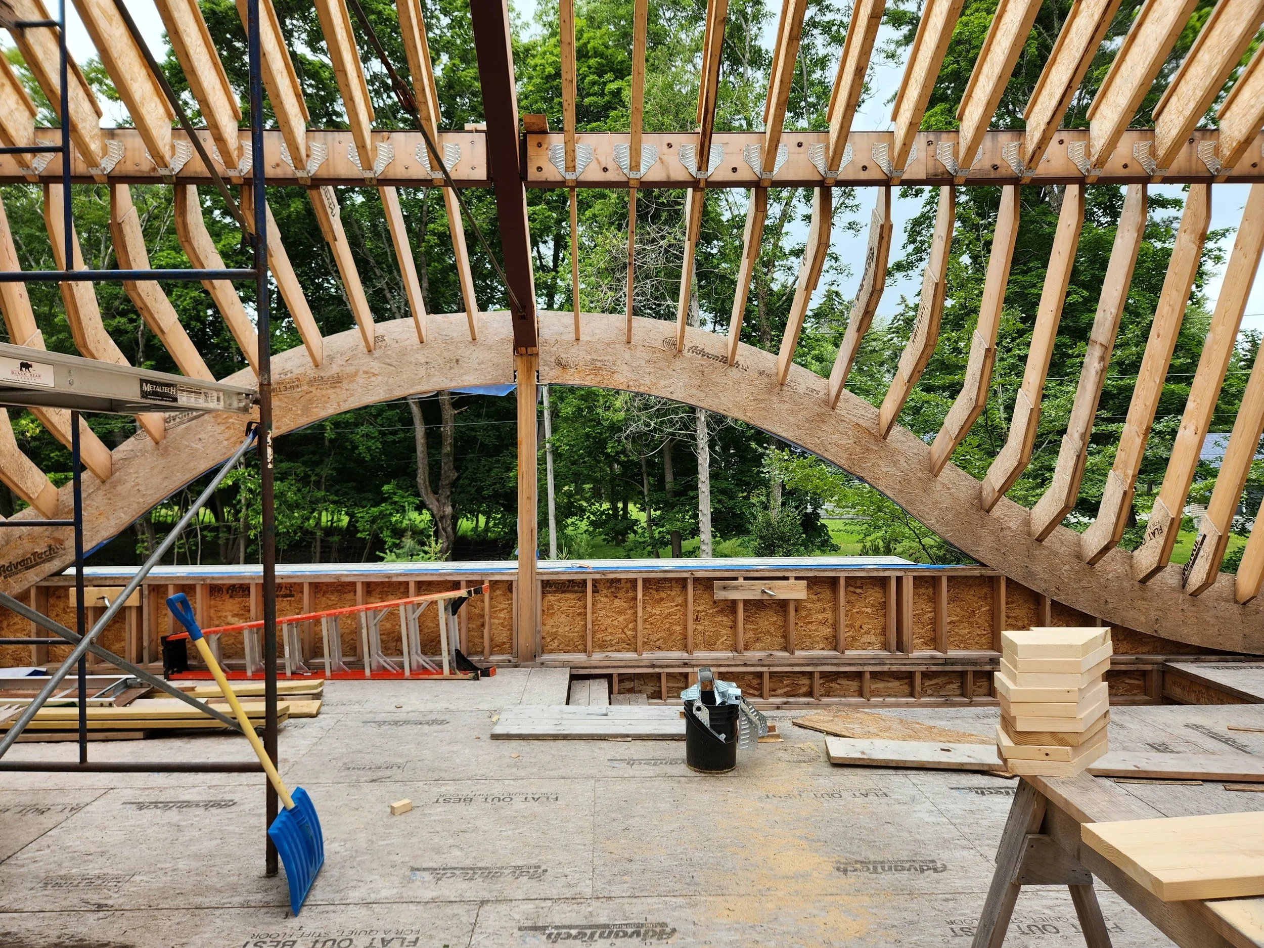 hewes-cnc-cut-curved-barrel-vault-roof-rafters-interior-construction.jpg