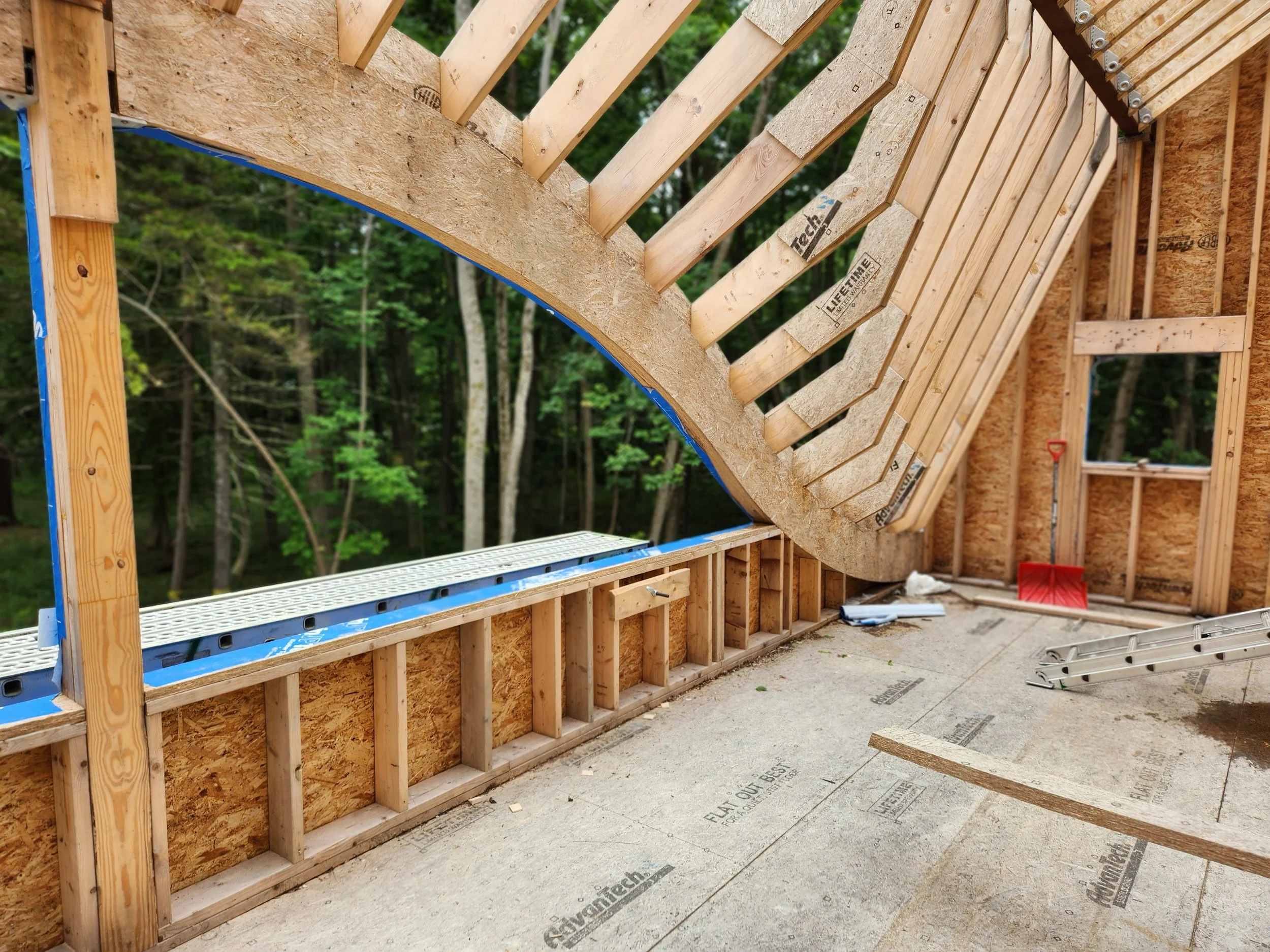 hewes-cnc-cut-curved-barrel-vault-roof-rafters-exterior-construction.jpg