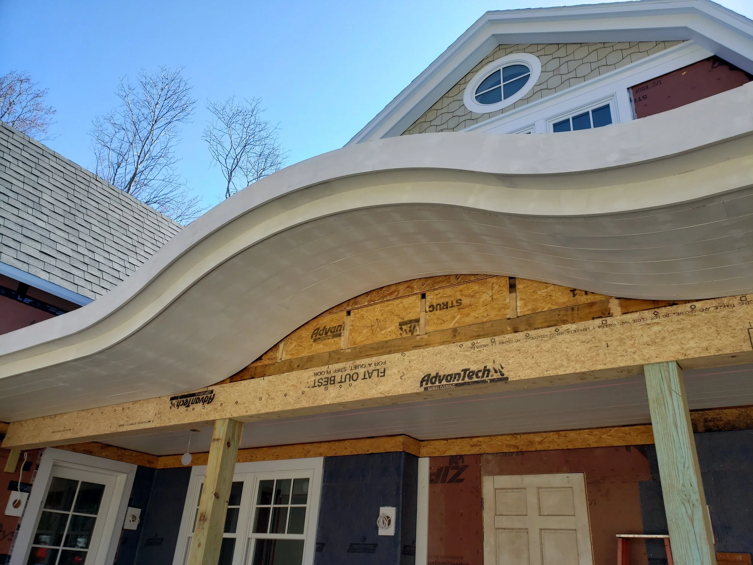 hewes-cnc-cut-curved-wave-roof-fascia-residential-exterior.jpg