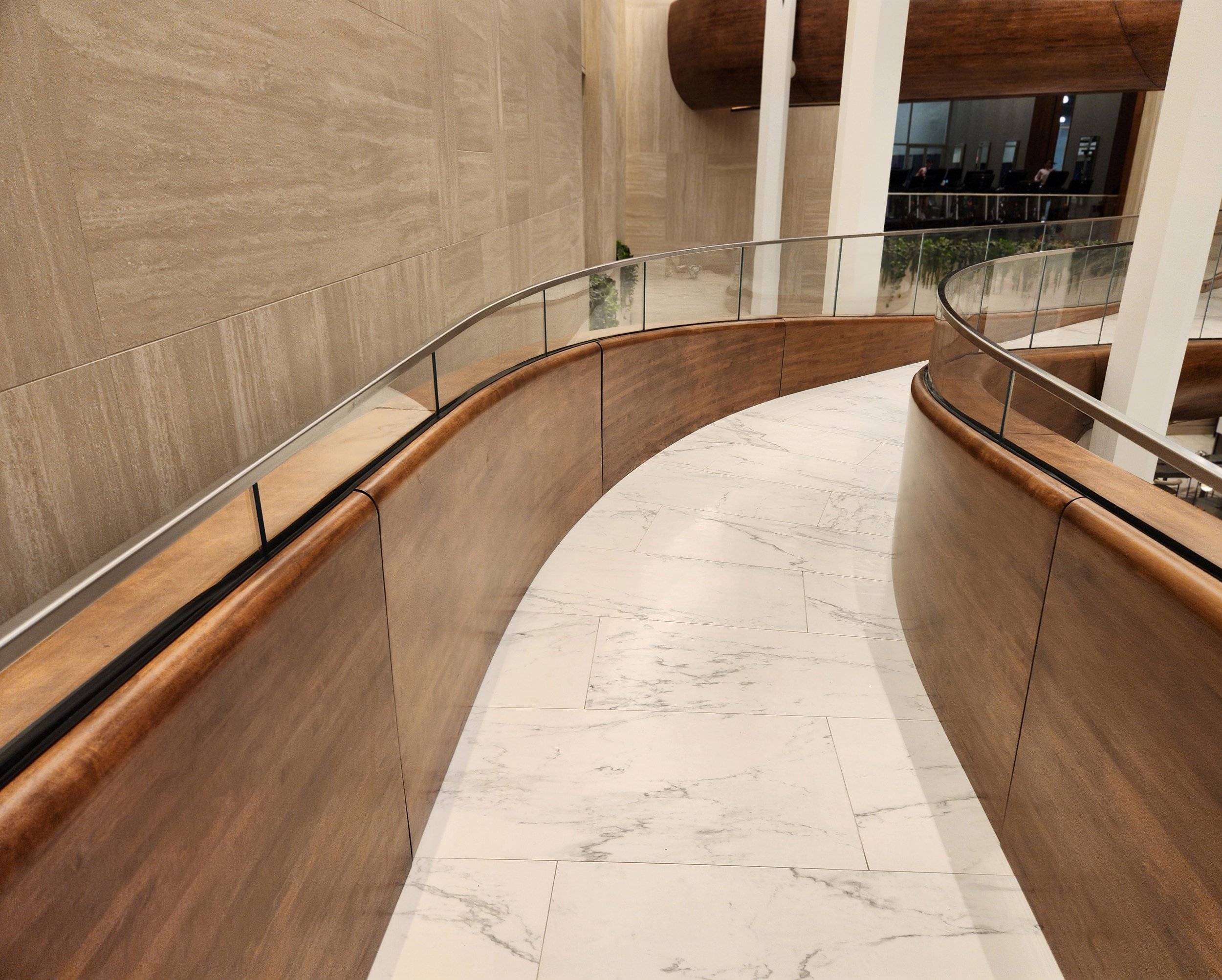 hewes-cnc-machined-curved-wood-handrail-wall-luxury-lobby.jpg