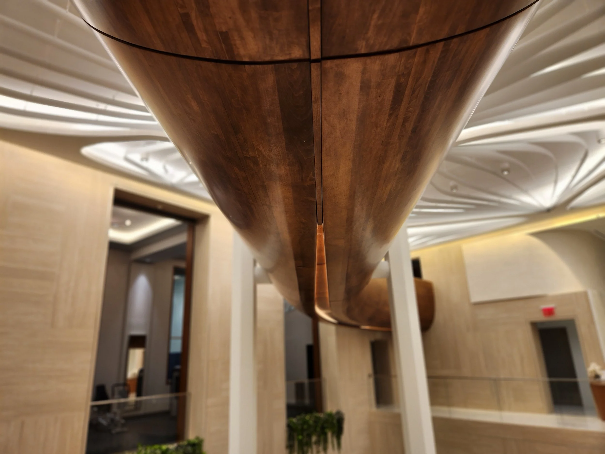 hewes-cnc-machined-sculptural-wood-stair-soffit-atrium-ceiling.jpg