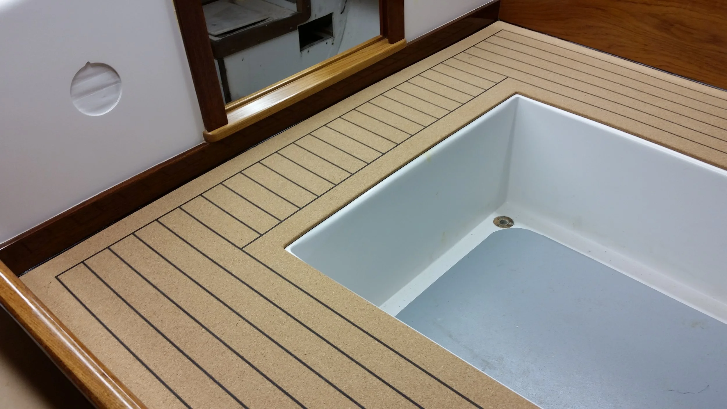 hewes-marine-deck-cnc-fabricated-synthetic-teak-cockpit-livewell-surround.jpg