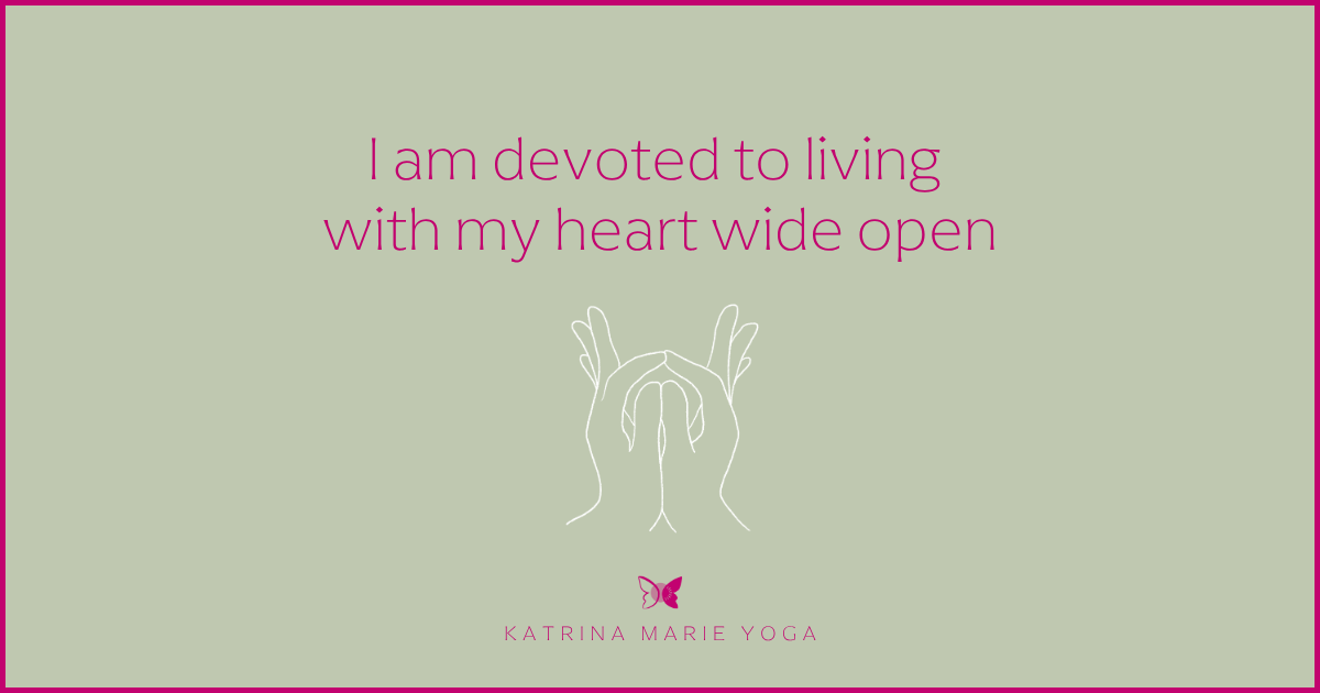 Sage green background with a magenta border and a white hand drawn sketch of Tejas Mudra, magenta text reading I am devoted to living with my heart wide open, KMY logo
