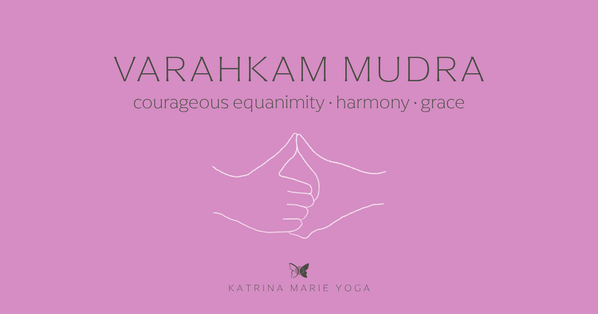Bubblegum pink graphic with a white line drawing of two hands in Varahkam Mudra, clasped with thumbs pointing up. Text reads "Varahkam Mudra — courageous equanimity, harmony, grace." Katrina Marie Yoga butterfly logo below.