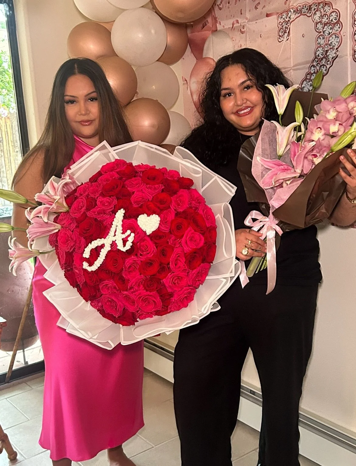 25th bday bouquets for me and my twin sis 🩷❤️🤎🤍 

50 red roses, 50 hot pink roses + star fighter lilies wrapped in frosted white paper with a white border❤️🩷a pretty cursive A + lil heart made of fake baby&rsquo;s breath🤍

one pink cymbidium orc