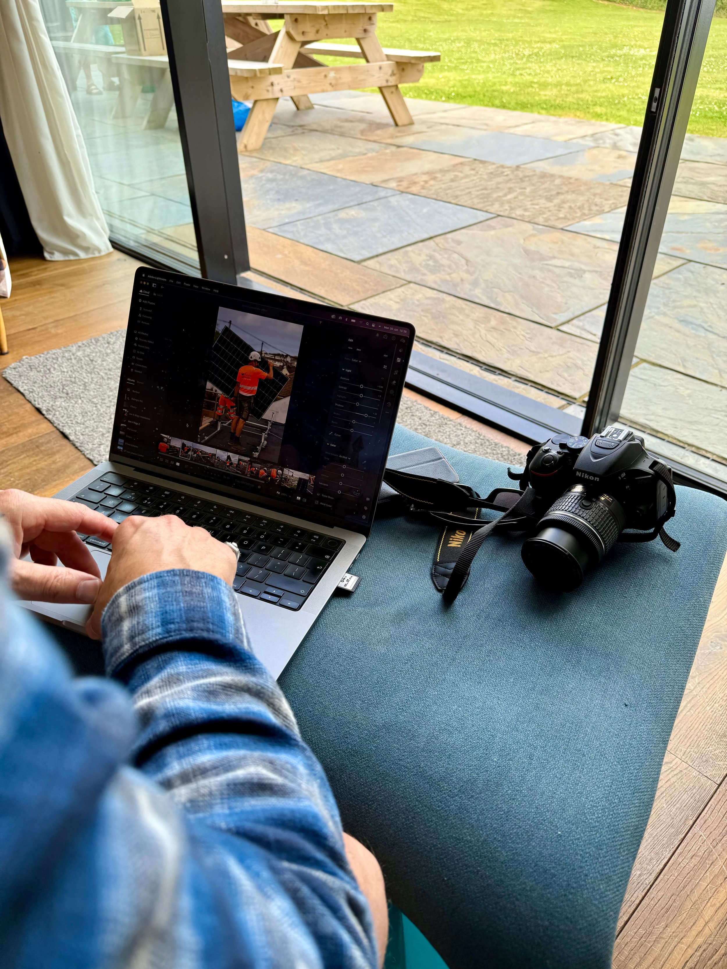 wildsea media creative director Chris editing images on a laptop