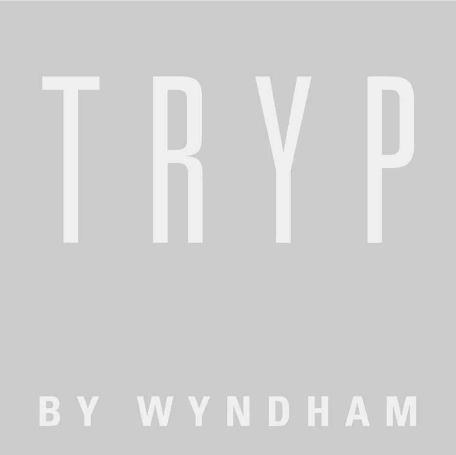 TRYP by Wyndham logo on gray background
