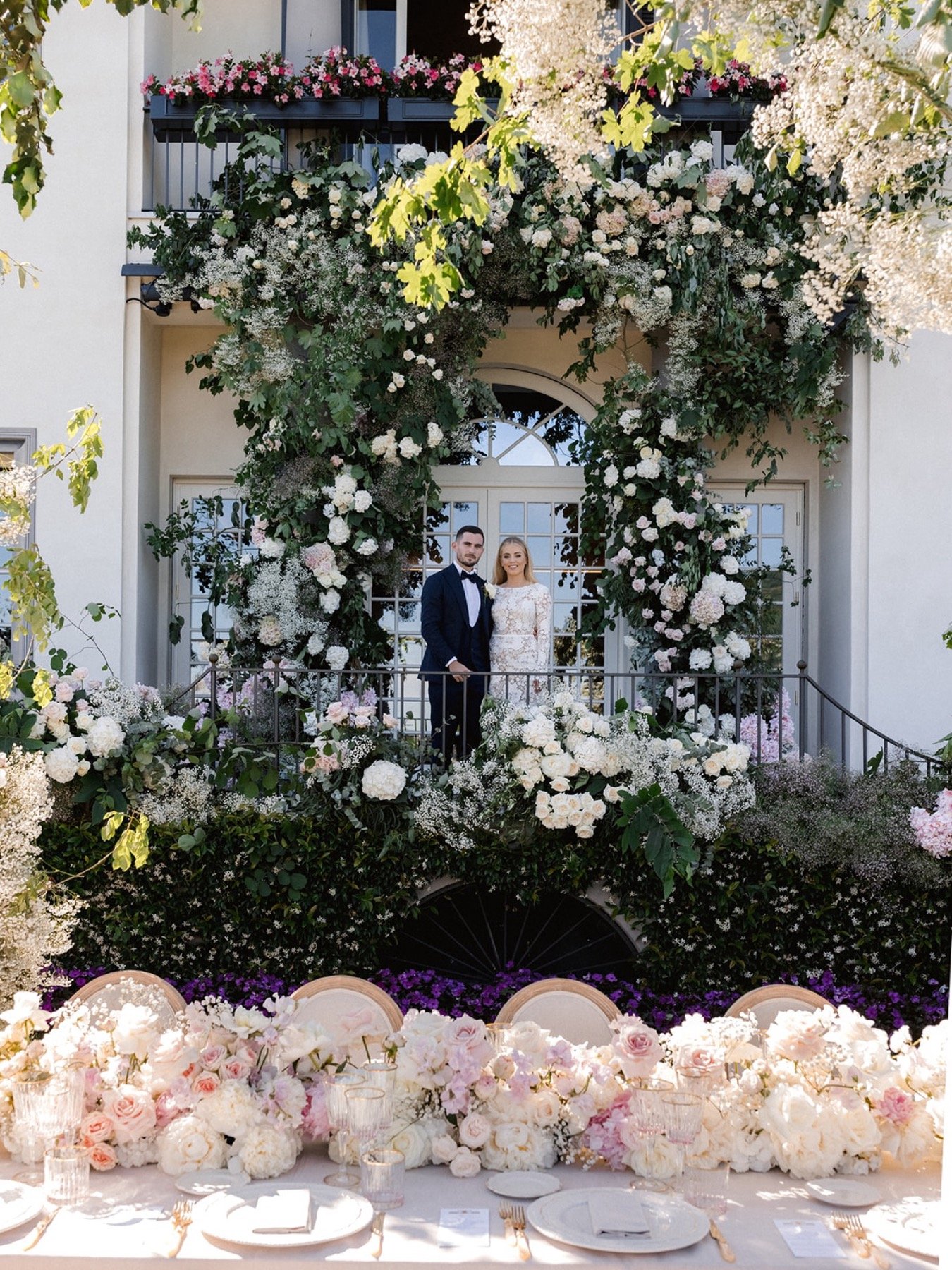 iconic-wedding-arch-flowers-and-table-floral-runner.jpg