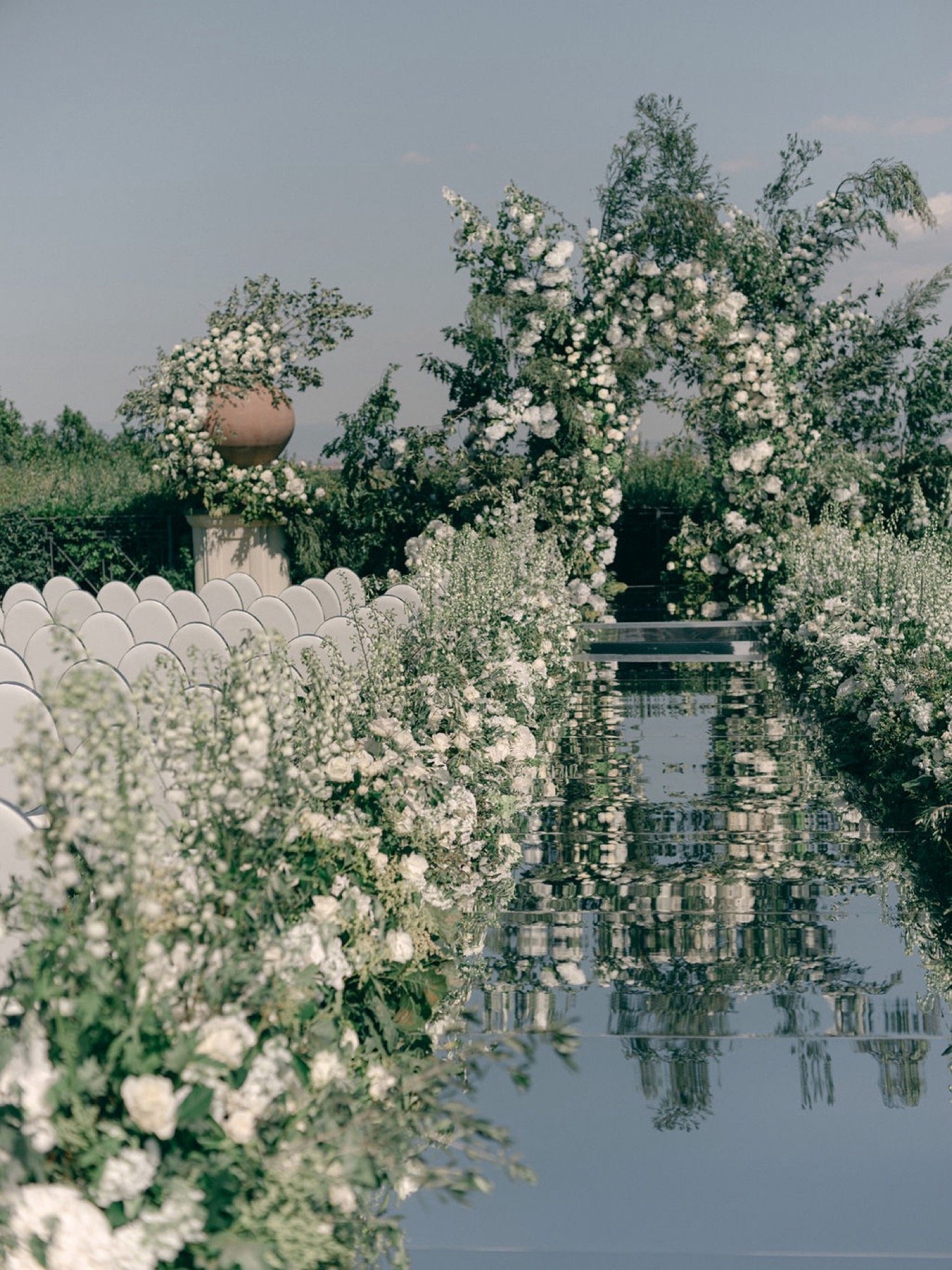 mirrored-aisle-framed-with-white-meadow-aisle-flowers.jpg