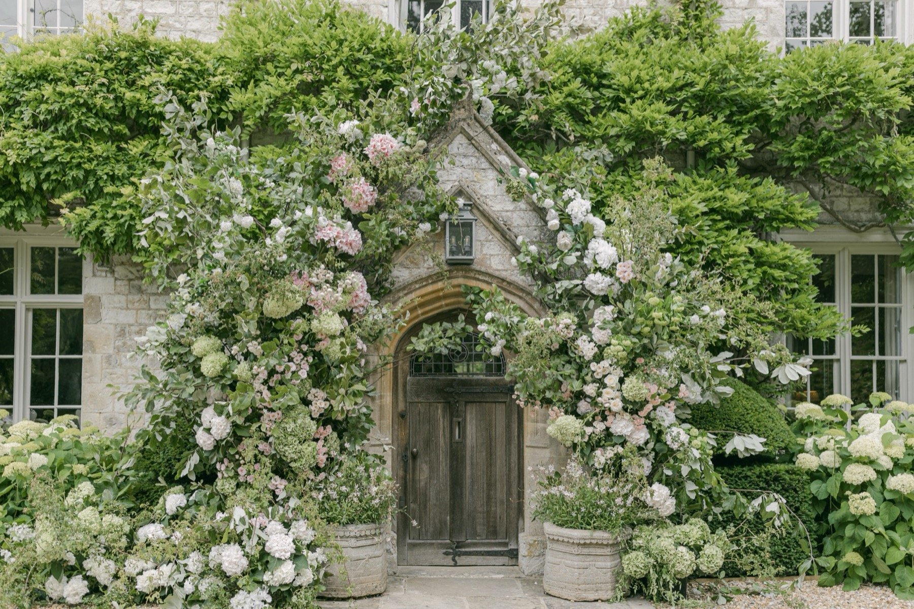 english-garden-style-wedding-arch-flowers-for-entrance.jpg