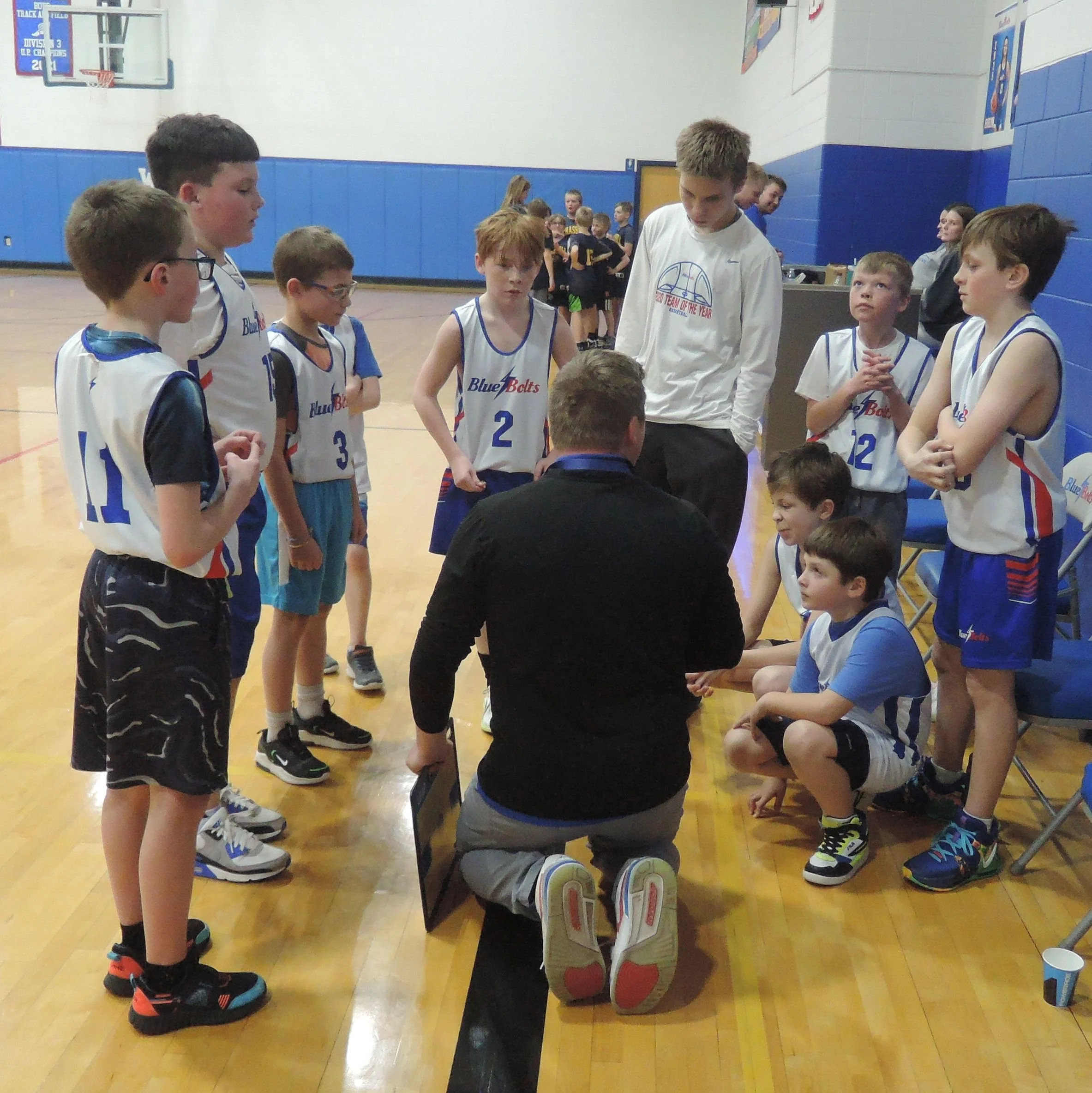 Elemetary boys basketball time out.