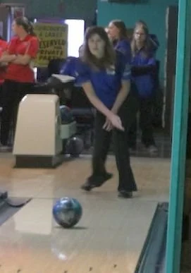 Dollar Bay bowling team member releasing the bowling ball and watching it travel towards the pins.