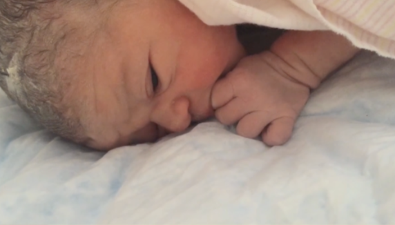 newborn baby showing hunger cues