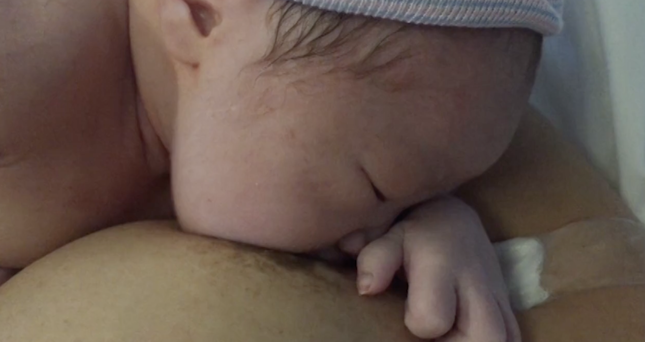 baby breastfeeding in hopsital