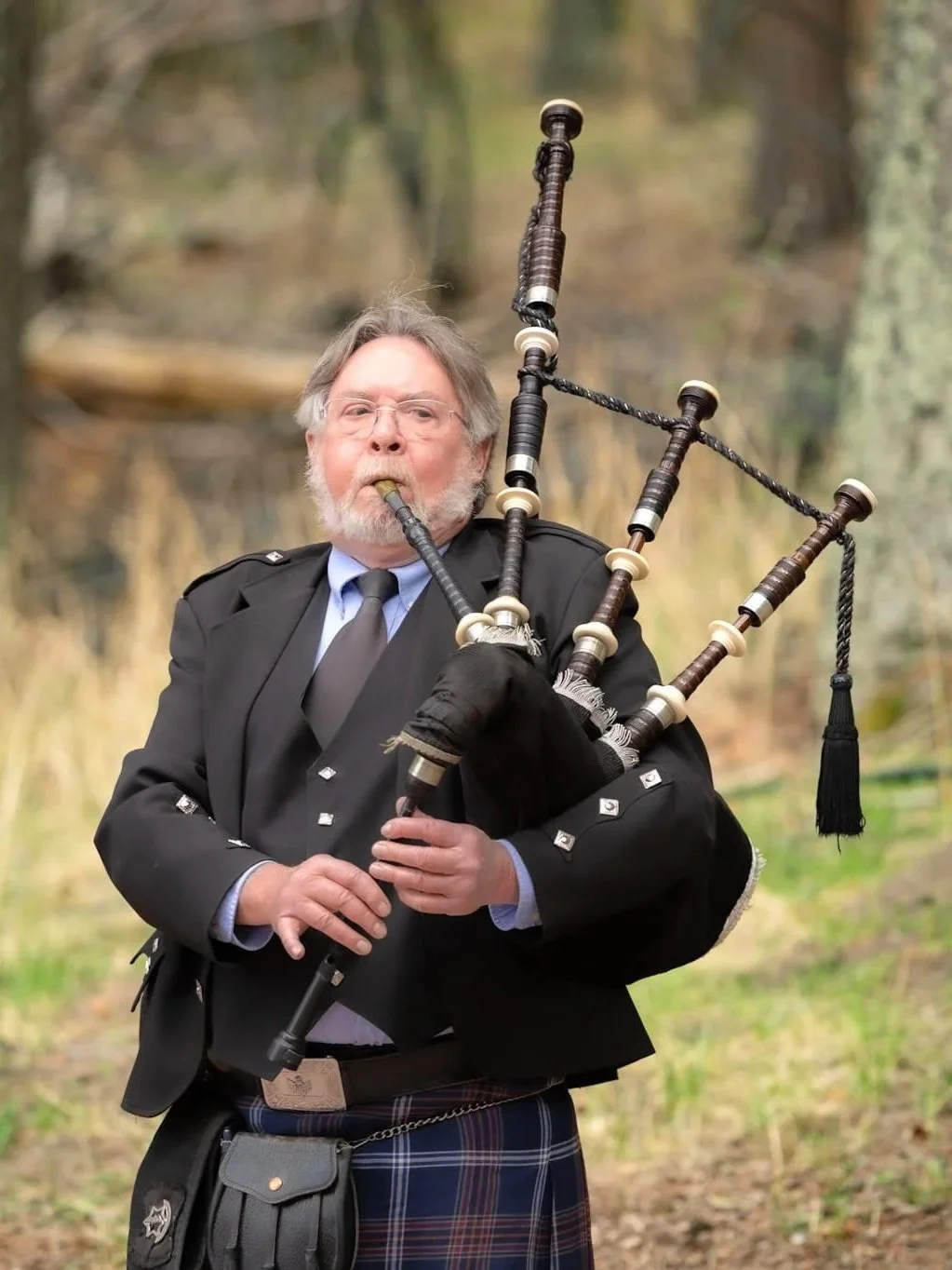 Bagpiper performing during a special event in Colorado, photographed by Grayson Flicks Photography.
