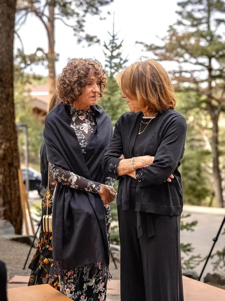 Two attendees sharing a conversation during a professional event in Colorado