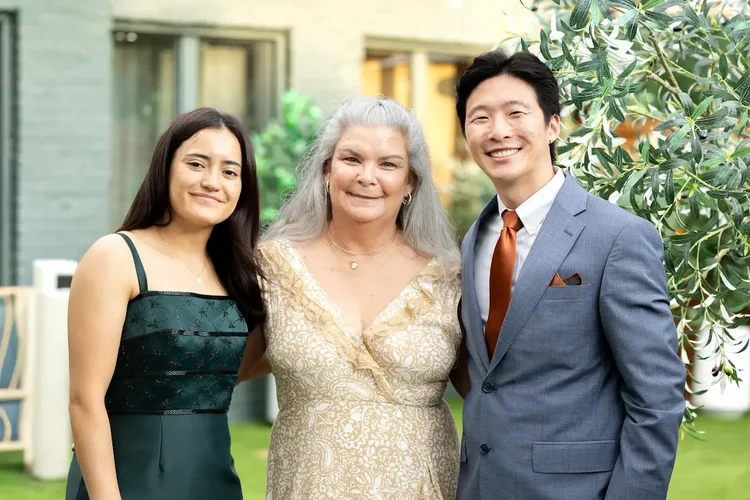 Three wedding guests smiling for an outdoor portrait at a Longmont, Colorado reception