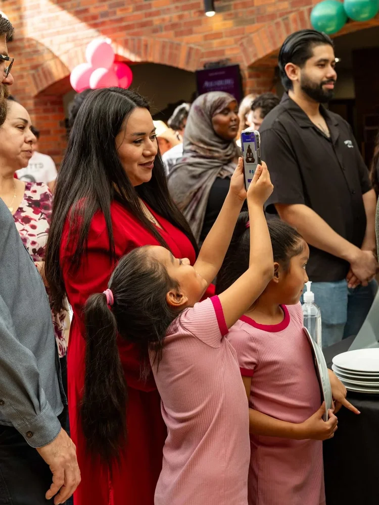 Families participating in activities during an indoor Colorado community event
