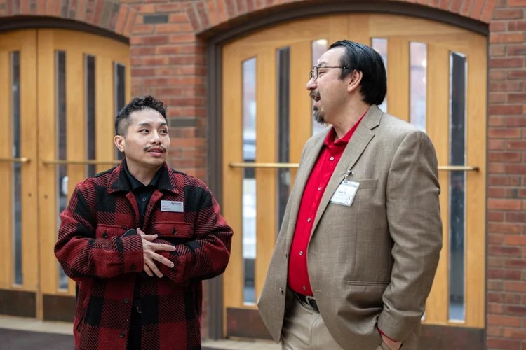 Two attendees talking during a professional networking event in Colorado