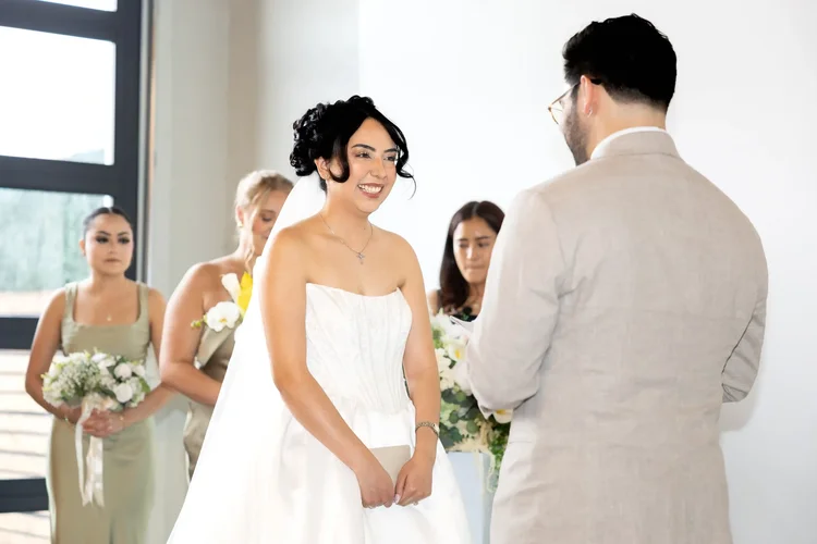 Bride smiling at the groom during their wedding ceremony in Longmont, Colorado