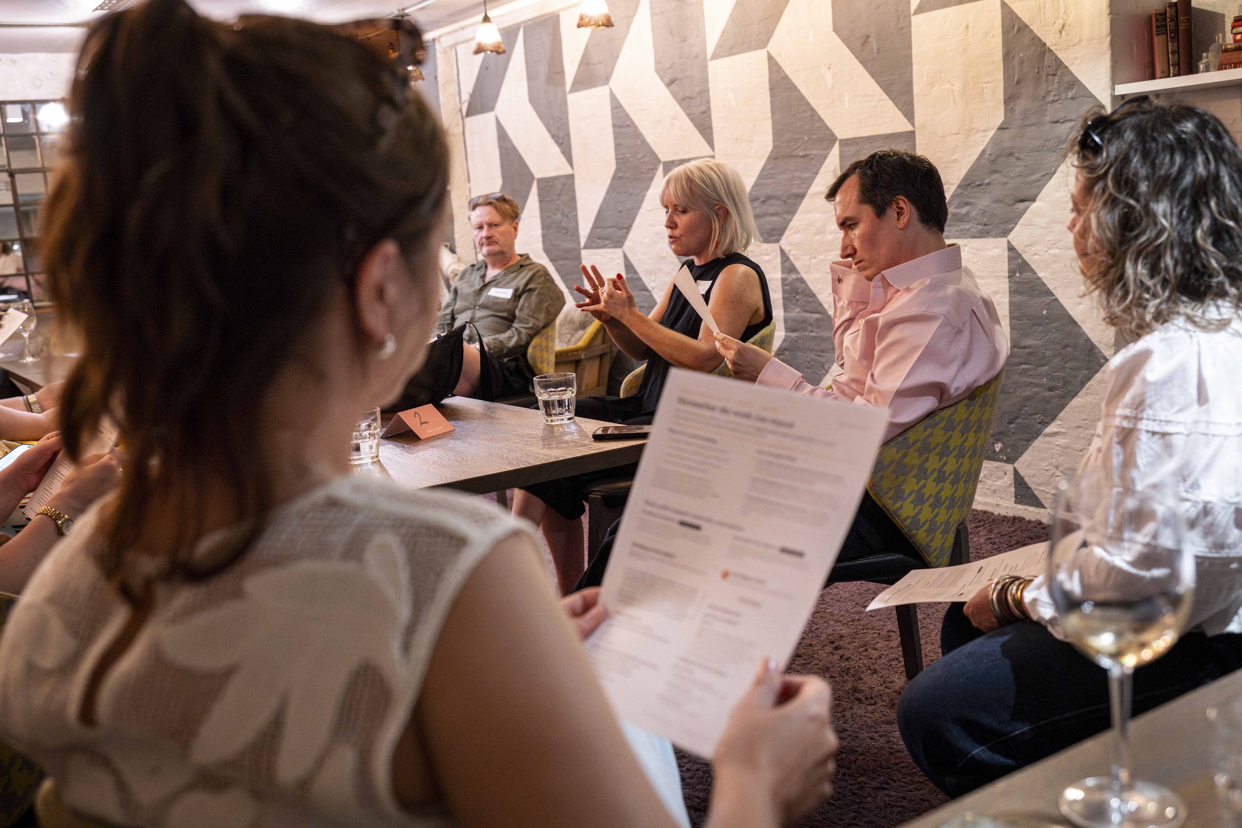 Attendees taking part in a roundtable discussion during an On Sale Live Lates networking event focused on live entertainment marketing.