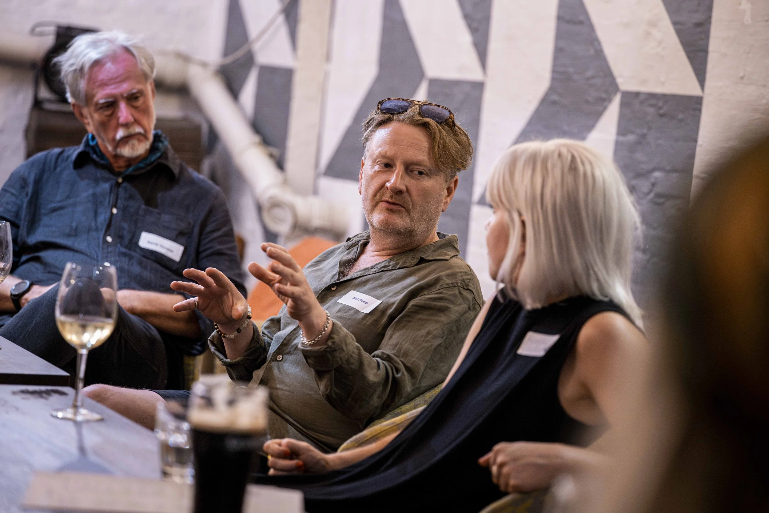 Industry professionals exchanging ideas during a panel discussion at an On Sale Live Lates event.