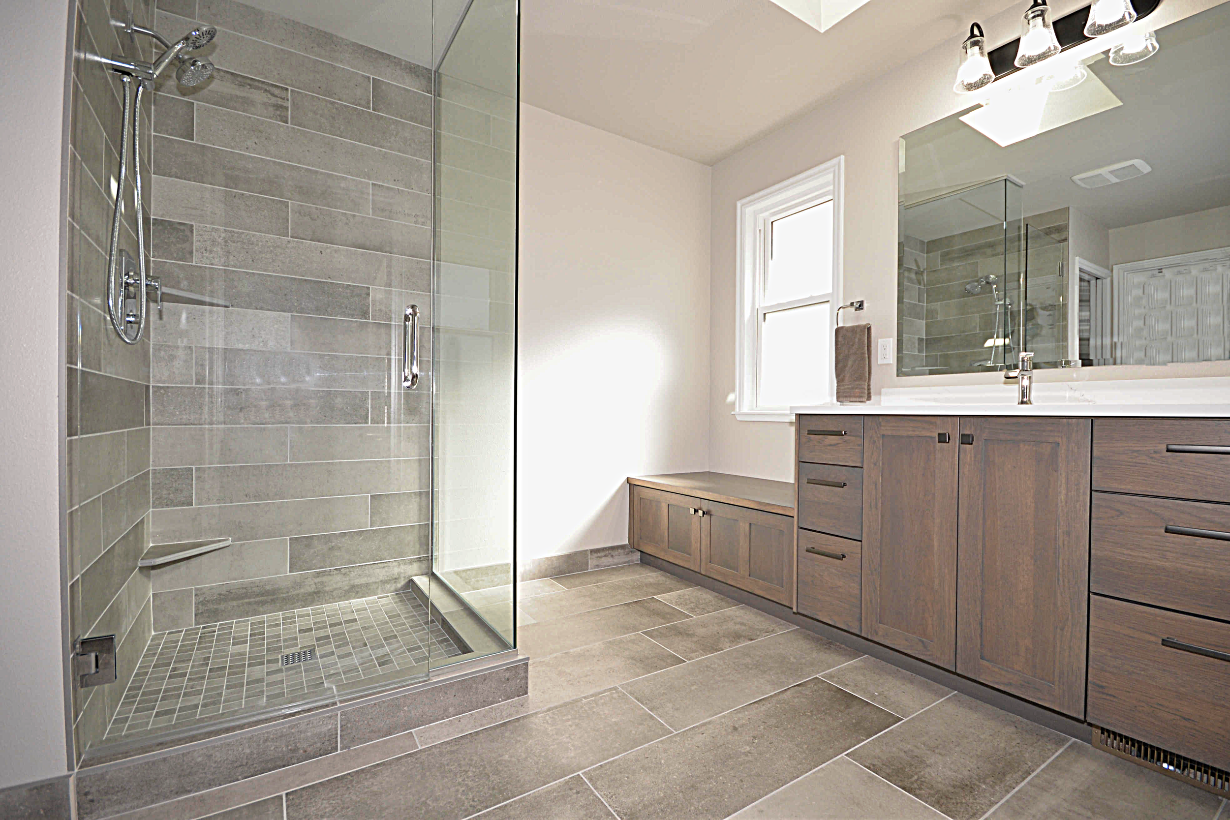 6x12 tiles in shower. Matching storage bench under window. 
